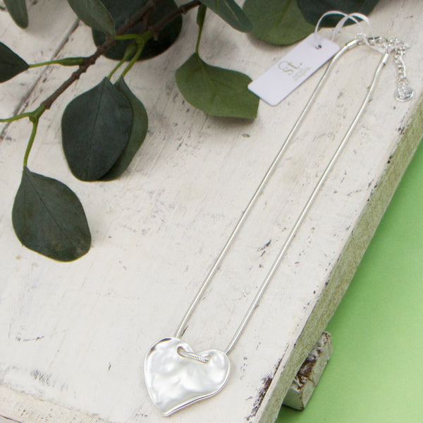Soft hammered heart shaped pendant on short snake chain necklace