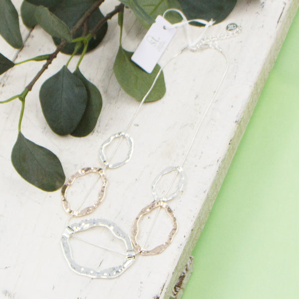 Open organic shapes on short snake chain necklace