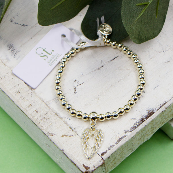 Angel wings charm on stretchy beaded bracelet