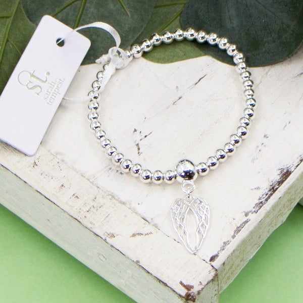 Angel wings charm on stretchy beaded bracelet
