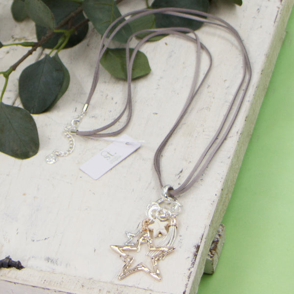 Multi star pendants on long grey suede necklace