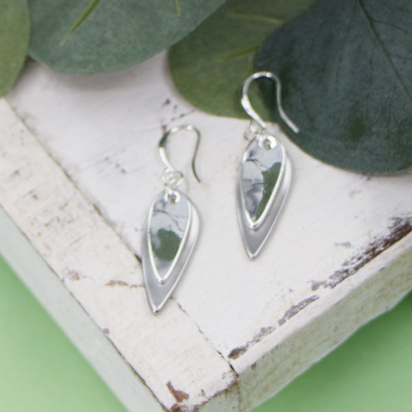 Layered oval shaped charms on fish hook earrings