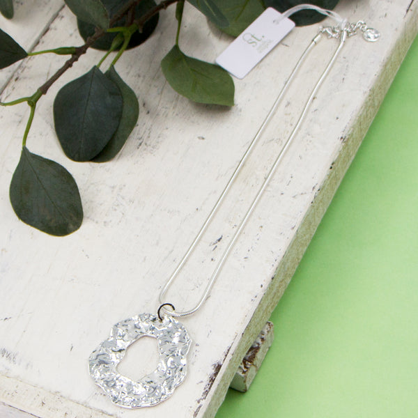 Textured open organic shape pendant on short snake chain necklace