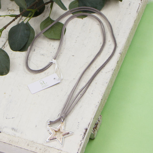 Long grey suede necklace with two open star pendants and crystals