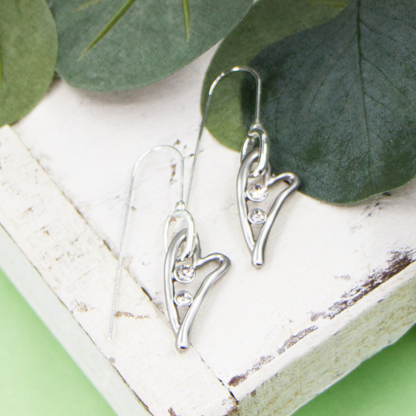 Elongated open heart shapes with crystals on fish hook earrings