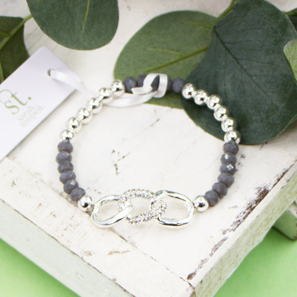 Stretchy beaded bracelet with grey glass beads