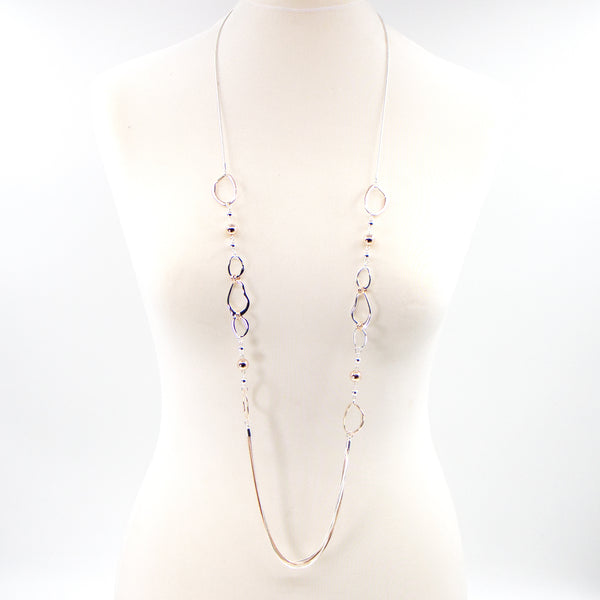 Long rope style necklace with open organic shapes