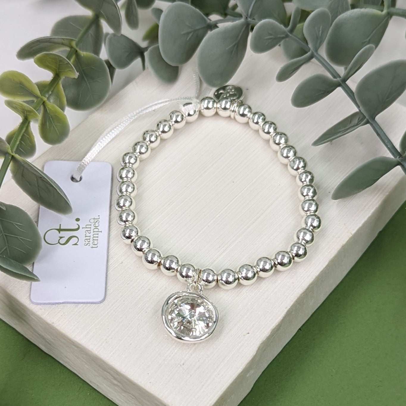 Simple beaded bracelet with soft hammered setting crystal charm ...