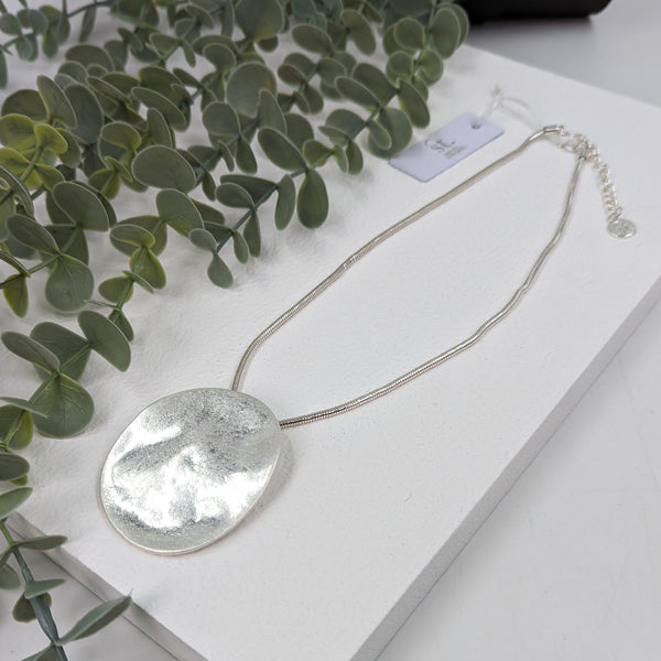 Soft hammered disc pendant necklace on snake chain