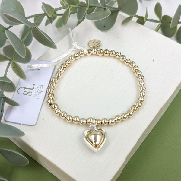 Beaded bracelet with 2 tone heart charm