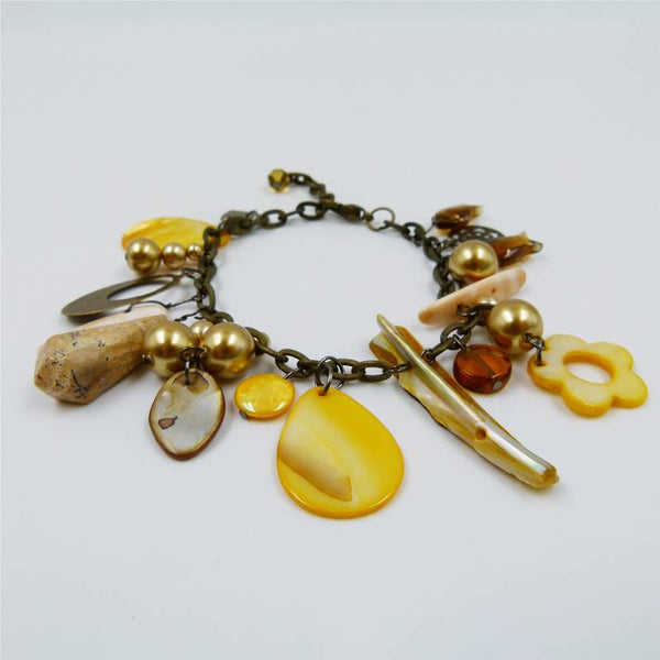 Charm style bracelet with shell and stone details