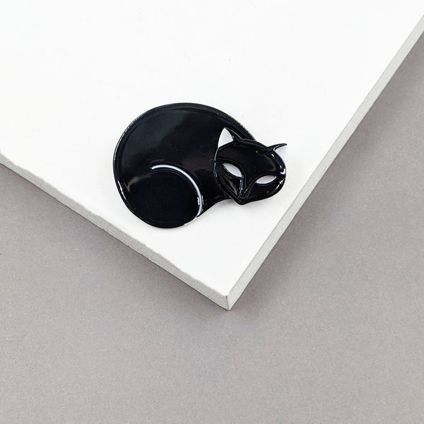 Curled up black cat resin brooch