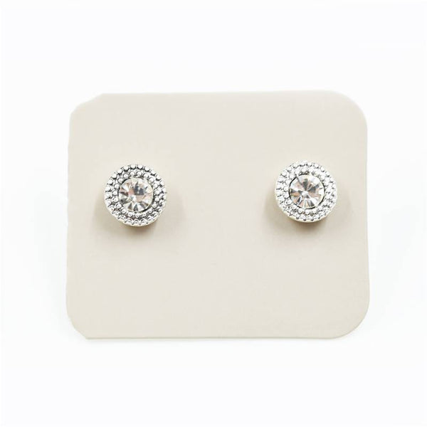 Dainty crystal stud earrings with pattern surround