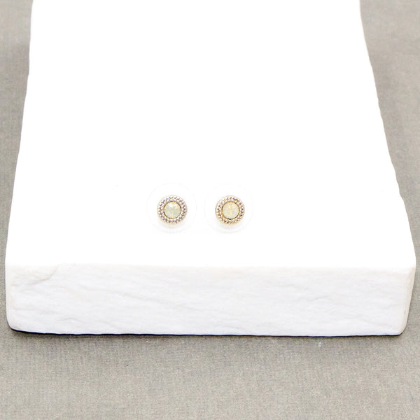 Dainty crystal stud earrings with pattern surround