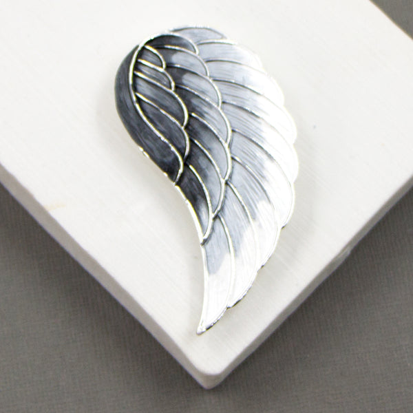 Magnetic angel wing brooch with grey tone enamel
