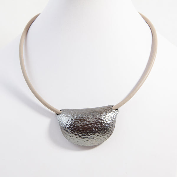 Contemporary half moon beaten pendant on leather