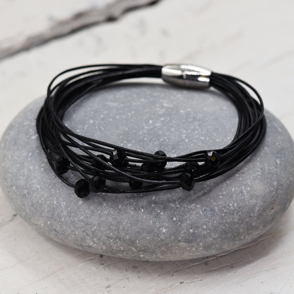 Multistrand leather bracelet interspaced with cut glass