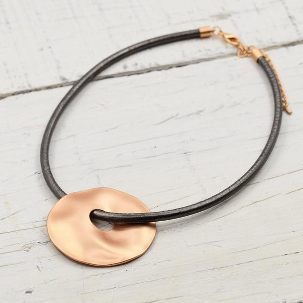 Large organic circle with hole on leather 