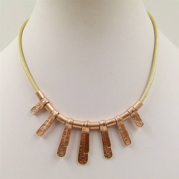 Contemporary graduated shapes on short leather necklace