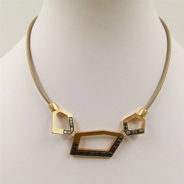 Cutout shapes with metal inlay on short leather necklace