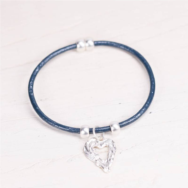 Cut out heart pendant on simple leather bracelet