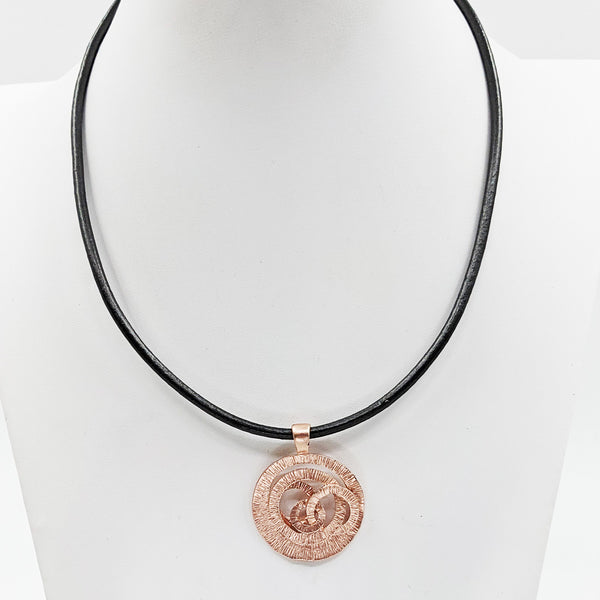 Organic swirl pendant on simple leather necklace