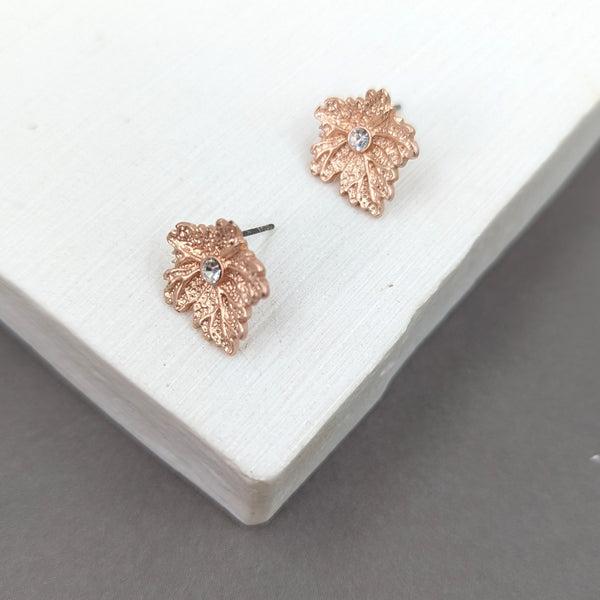 Matte rose gold statement leaf earrings with crystal feature