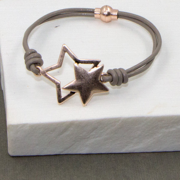 Open & closed stars  on leather bracelet