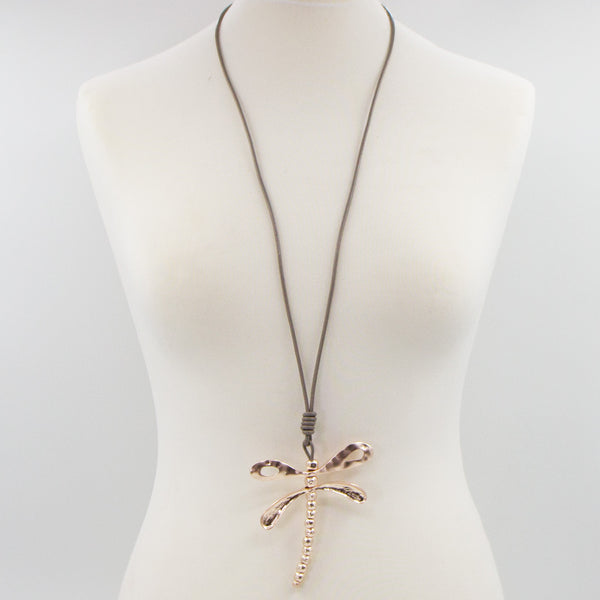Beaten effect dragonfly pendant on long leather necklace