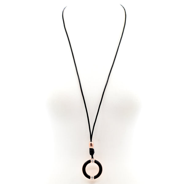 Circle pendant with crystal feature on long leather necklace