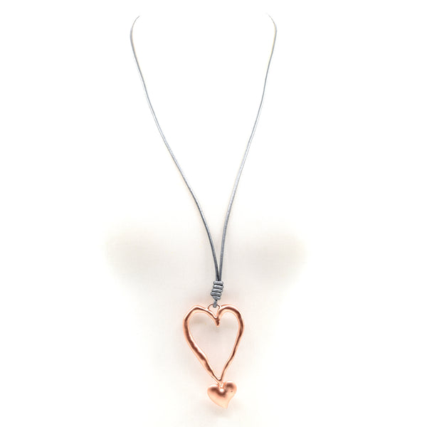 Large cut out heart w/smaller heart on long leather necklace