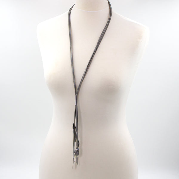 Long suede tassle necklace with leaf like hanging components