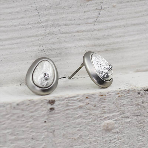 Framed egg shaped stud earrings with little crystals
