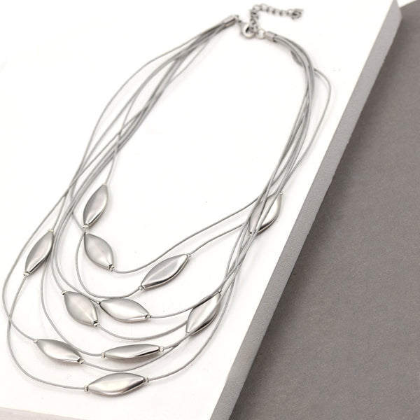 Multi strand necklace with leaf shape pendants