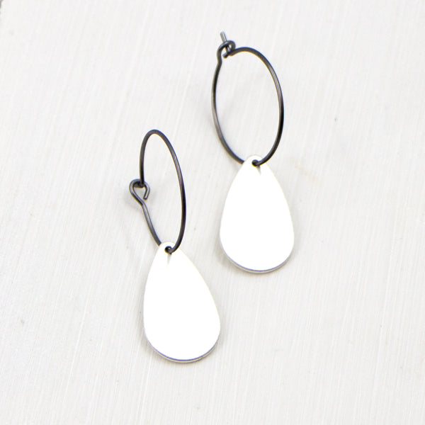 Contemporary hoop earring with petal-like component