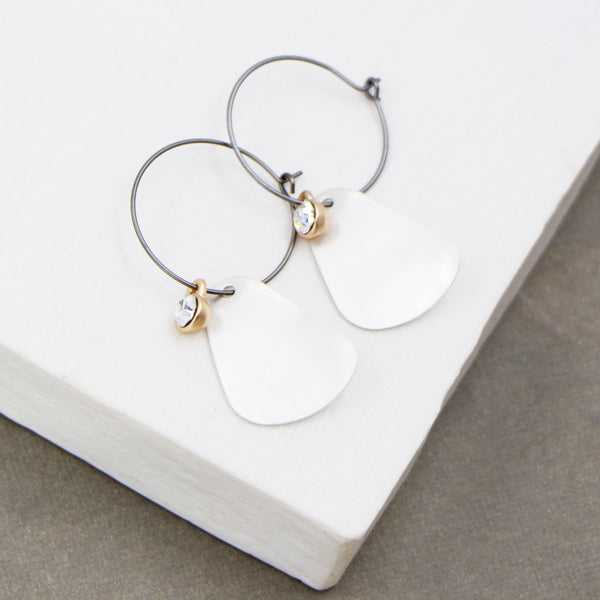 Contemporary hoop earring with petal-like component and crystal