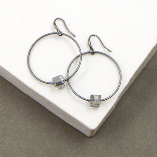 Simple fine hoop with cut glass cube element