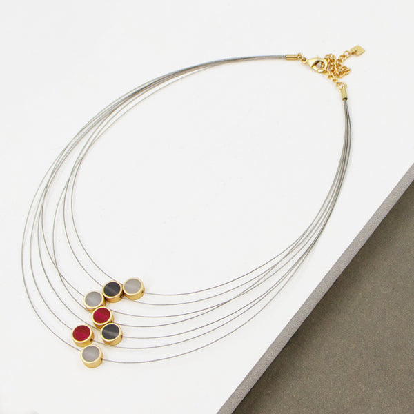Contemporary multi wire necklace with resin inlay circles