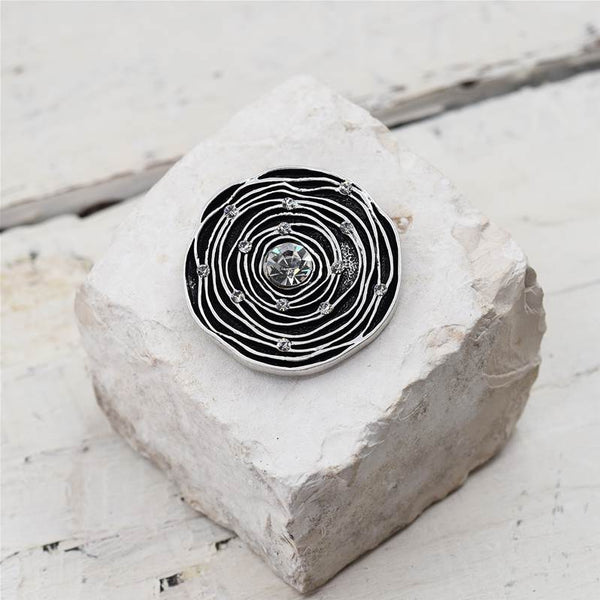 Flower shaped brooch with clear crystal centre