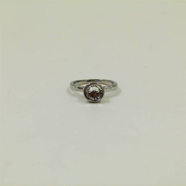 Simple beaten ring with encased stone