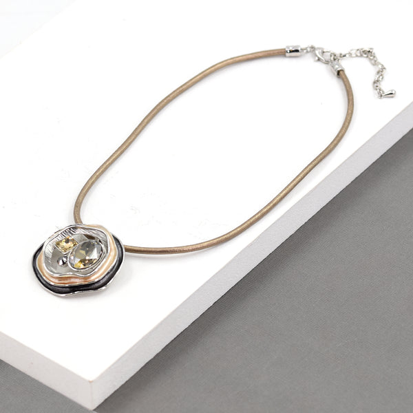 Organic shaped pendant with crystal on leather short necklace