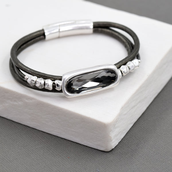 Triple strand leather bracelet with crystal pendant