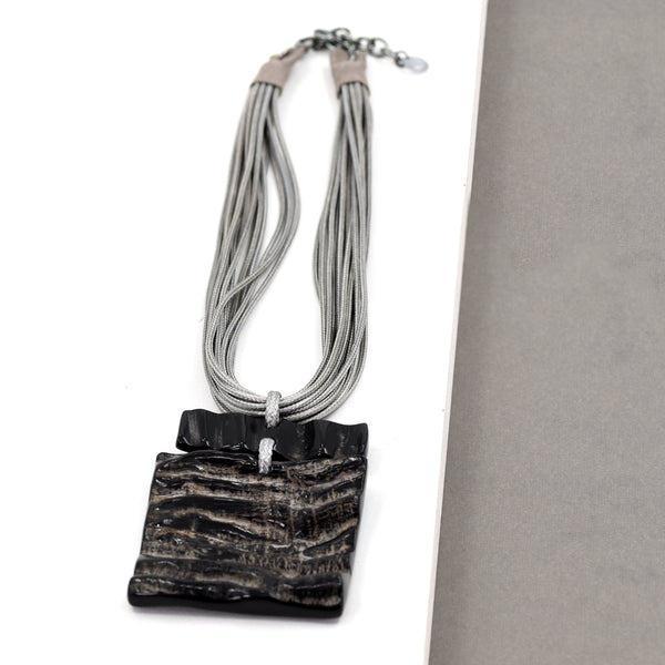 Short square horn pendant necklace on multi strand cord