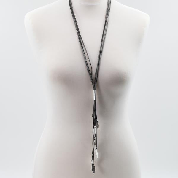 Long suede tassle necklace with leaf like hanging components