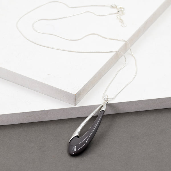 Large teardrop shaped pendant on long chain necklace
